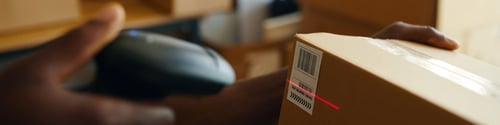 Preview: Man Scanning Barcode On Order