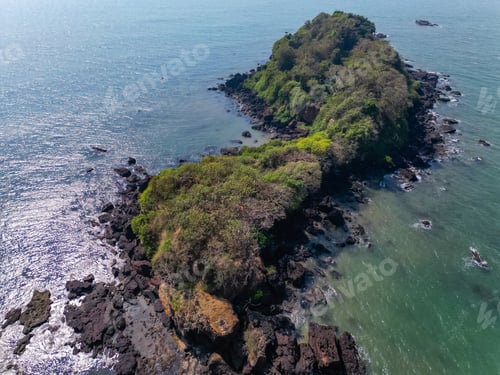 Preview: Aerial top view on tropical beach with green palm trees under sunlight Drone view in Goa