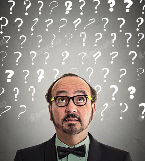 Preview: Headshot Middle Aged Man With Puzzled Face Expression And Question Marks Above Head Looking Up
