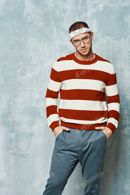 Preview: handsome man in striped sweater posing fashion self confidence