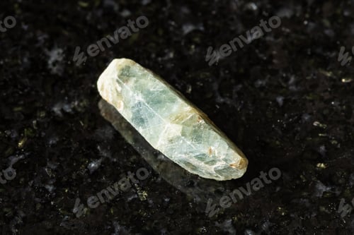 Preview: rough green sapphire corundum crystal on black