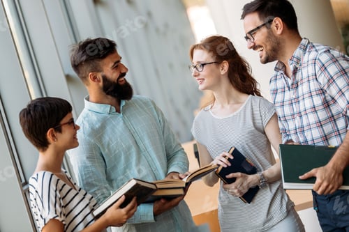 Preview: Group of students discussing in university library