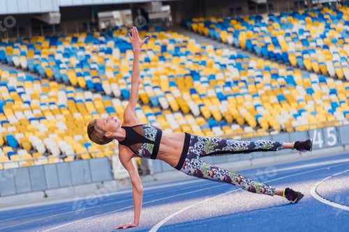 Preview: Fitness Trainer. Girl Doing Exercises At The Stadium