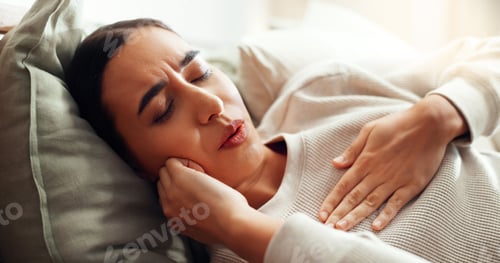 Preview: Woman, sore chest and sick in home, virus influenza and laying on bed with bacteria infection. Fema