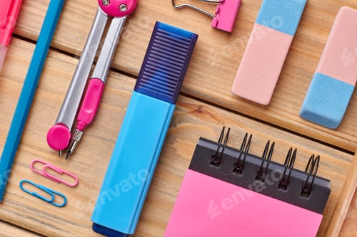 Preview: School supply set on wooden background.