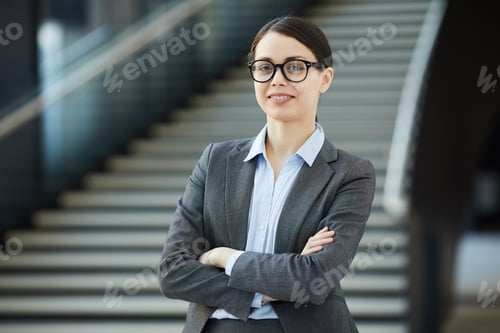 Preview: Positive young female intern in glasses