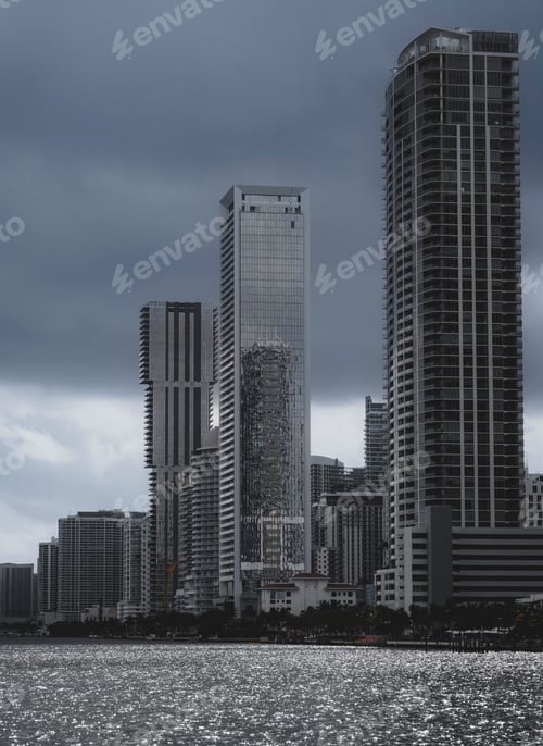 Preview: Stunning image of a city skyline featuring modern skyscrapers against a dramatic sky on a cloudy day