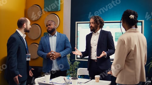 Preview: Coworkers from global business enterprise sharing ideas for products or services