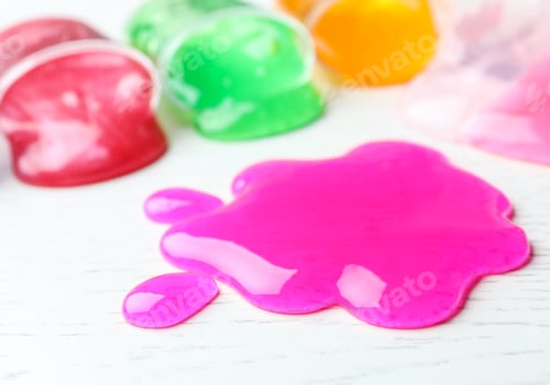 Preview: Splash of pink slime on white wooden background