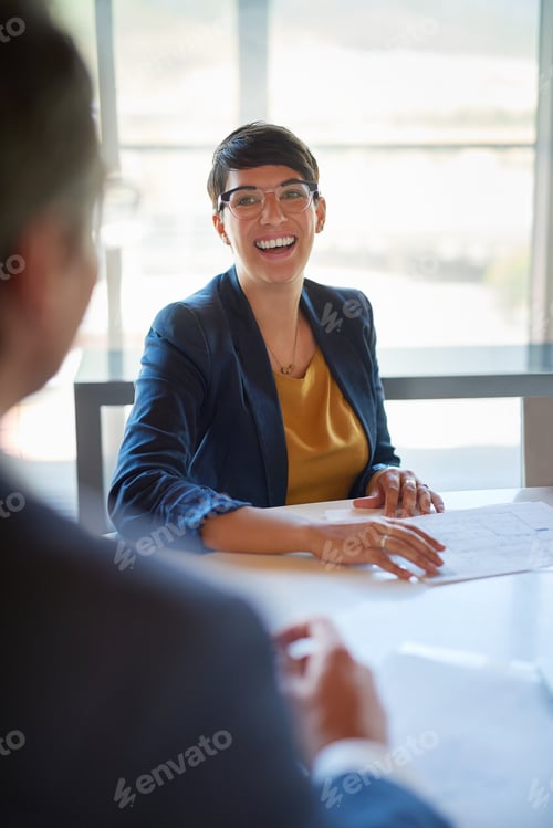 Preview: Smiling Woman at Corporate Meeting in Bright Office