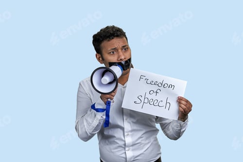 Preview: Young indian male with megaphone and freedom of speech iscription.