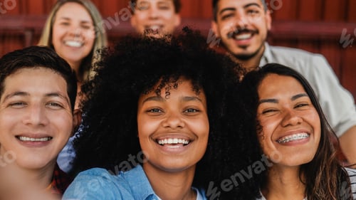 Preview: Happy multiracial friends taking selfie with smartphone smiling together outdoor