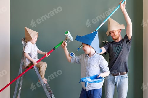 Preview: Repair in the apartment. Happy siblings boys and their dad start painting the wall