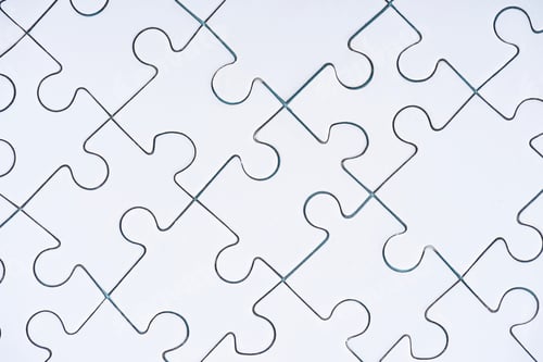 Preview: full frame of arranged white puzzles background
