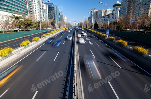 Preview: Beijing/China - July 05 2019: Beijing road by Chinese buildings under blue sky