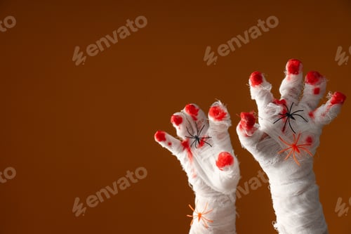 Preview: Hands wrapped in a bandage with blood on the fingers