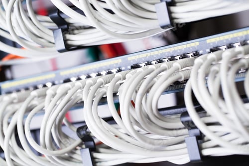 Preview: Gigabit network switch with aligned patch cables in datacenter