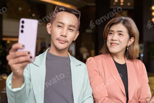 Preview: Transgender and non-binary coworkers working remotely in cafe