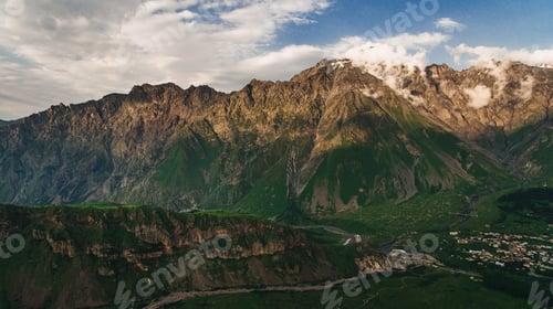 Preview: aerial view of green mountains with cloudy sky, Georgia