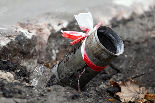 Preview: Fragment of a Russian rocket hail sticking out of the asphalt in the center of Kherson, Ukraine.