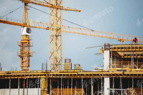 Preview: View of a construction site with buildings under construction and multi-storey residential homes.