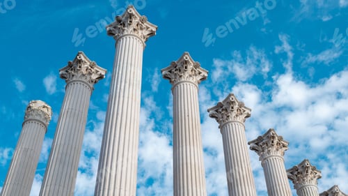 Preview: Majestic ancient columns under a blue sky.