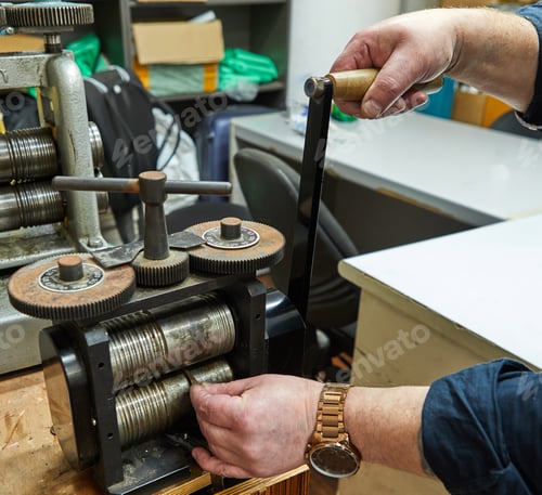 Preview: Jewelry production. Recycling raw materials. Jewelry craft on the metal-rolling machine.