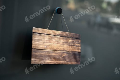 Preview: the simple sign board frame hanging on the wall of the building exterior with copy space mock up, de