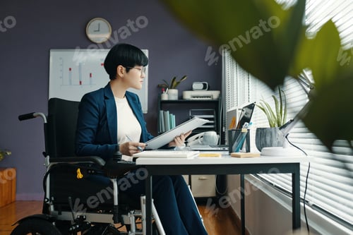 Preview: Businesswoman With Disability Working With Documents