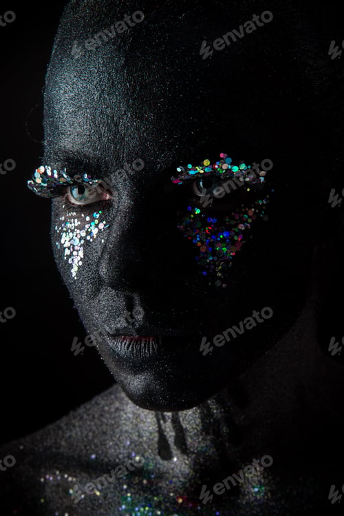 Preview: Girl in black makeup with sparkles