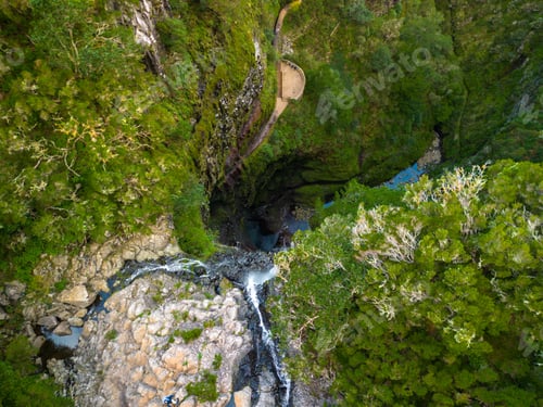 Preview: Scenic view of Levada 25 waterfalls surrounded by lush greenery. Madeira, Portugal
