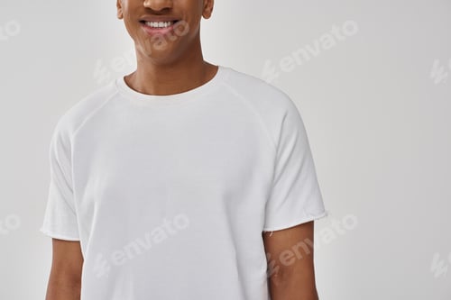 Preview: fashionable african american male model in casual white t-shirt, copy space for advertising
