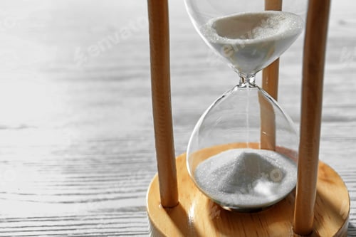 Preview: Hourglass with flowing sand on wooden background. Time management