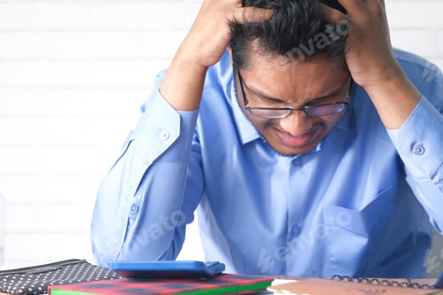 Preview: Depressed man feeling sick and worried about financial problem