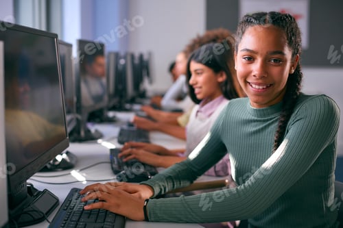 Preview: Portrait Of Female Secondary Or High School Student Sitting At Computer Screen In IT Class