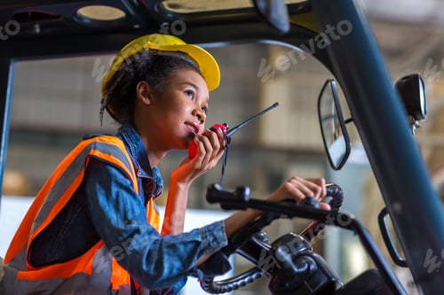 Preview: women worker at forklift driver happy working in industry factory logistic ship