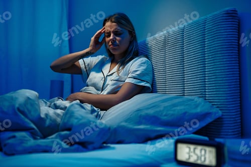 Preview: A woman struggles with nighttime anxiety and headaches in her bedroom, impacting her comfort