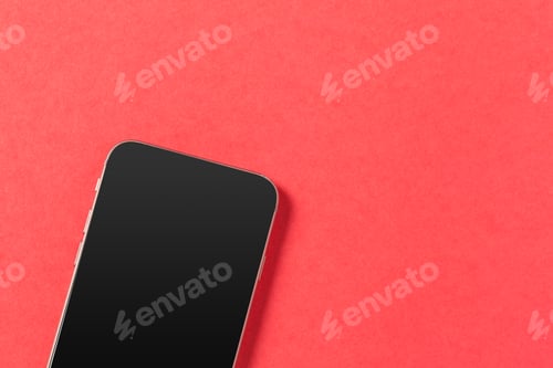 Preview: Smartphone on a bright red background showcasing modern technology and design