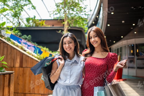 Preview: Portrait of Asian women shopping goods outdoor in department store.