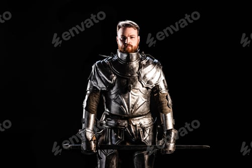 Preview: handsome knight in armor holding sword isolated on black