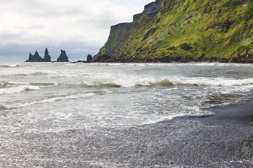 Preview: Reynisdrangur rock pinacles and black sand beach. Vik, South area. Iceland