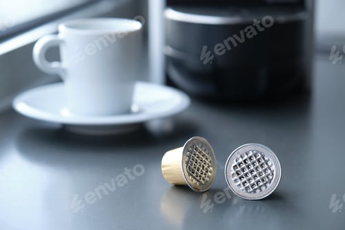 Preview: Two used coffee expresso capsules.