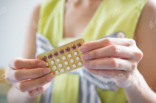 Preview: Woman hand holding a contraceptive panel prevent pregnancy