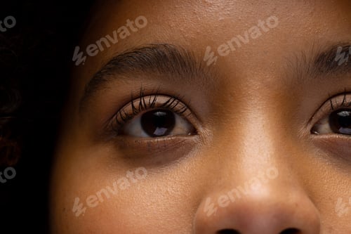 Preview: Close up of eyes of biracial woman looking away
