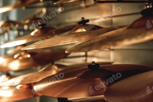 Preview: Choosing drum set. Close up view of several golden drum cymbals in a music shop. Music concept