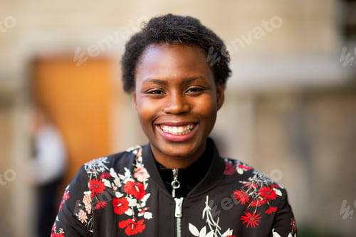 Preview: Closeup portrait of stylish young african american woman with short hair