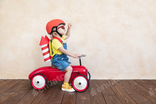 Preview: Kid playing with toy rocket at home