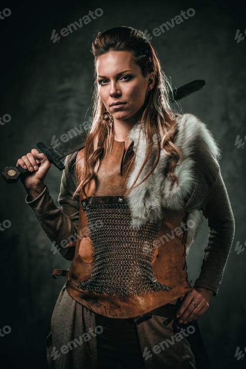 Preview: Viking woman with cold weapon in a traditional warrior clothes