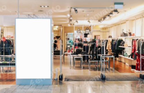 Preview: Clothes shop entrance in shopping mall with empty billboard mockup to place text or logo