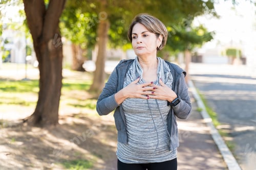 Preview: Elderly Woman Taking Deep Breaths While Looking Away